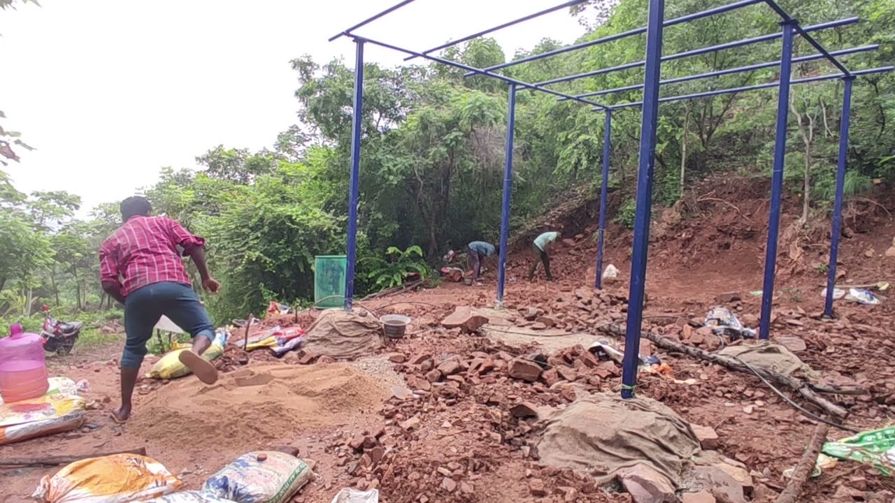 Concrete being mixed for the basement after the pipes were set.