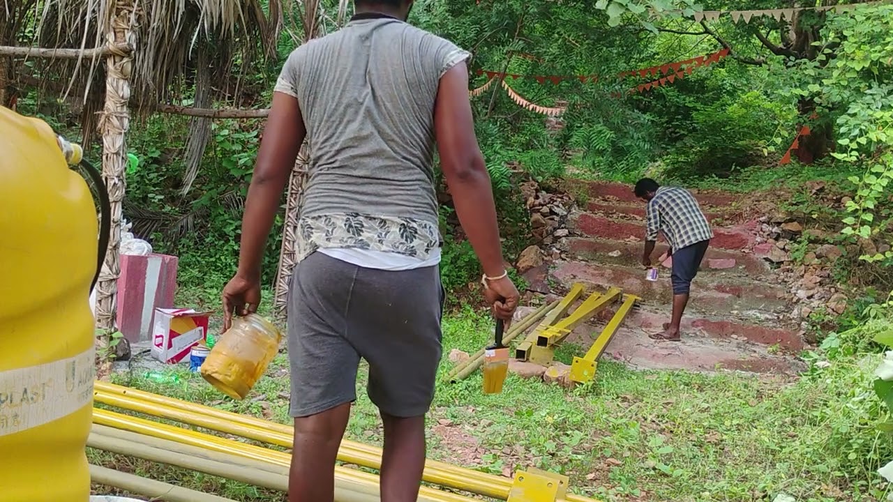 The iron pipes being painted before the old shed came down.